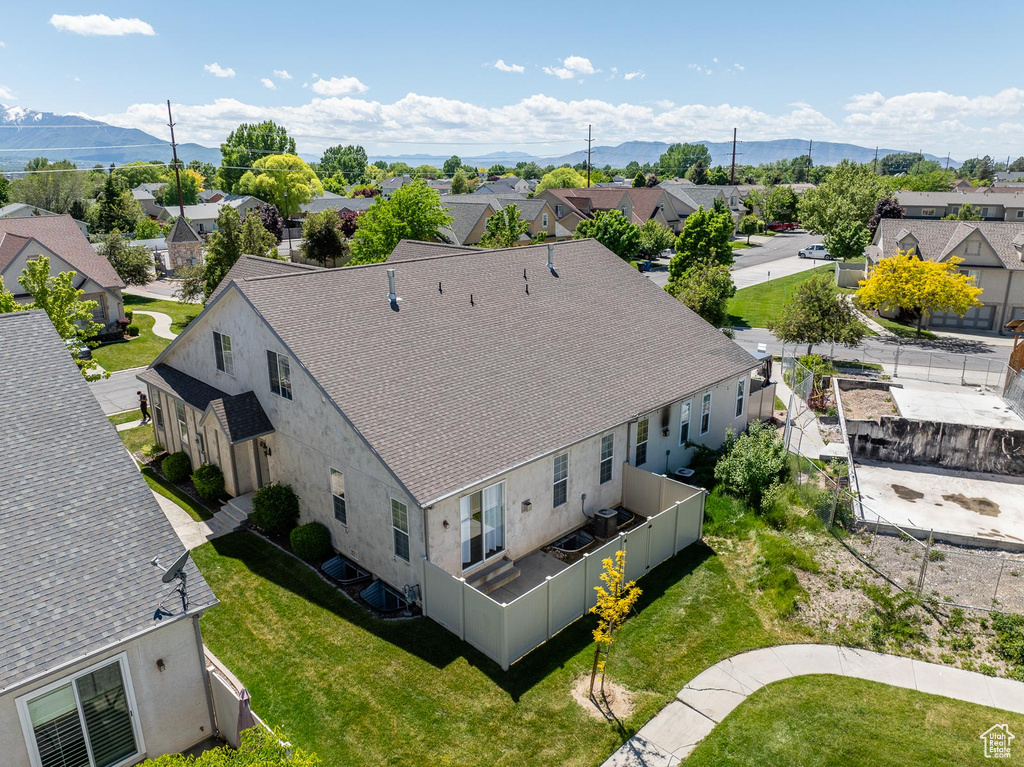 Birds eye view of property with a mountain view