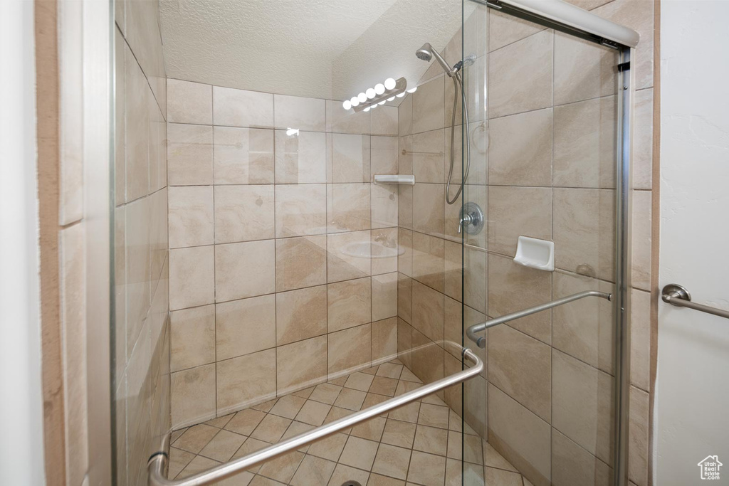 Bathroom with a shower with shower door