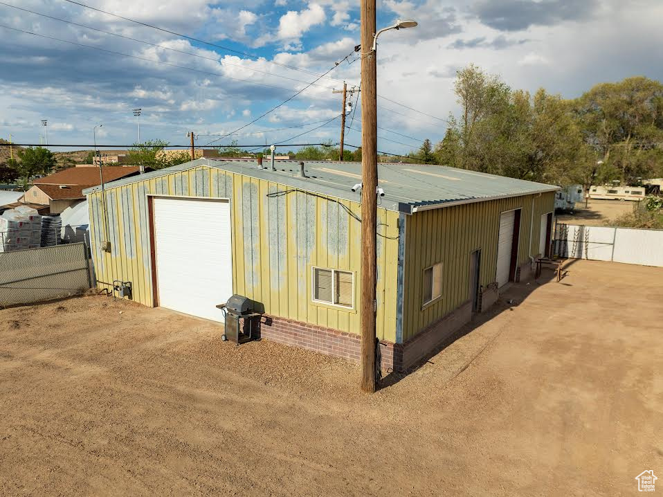 View of outdoor structure featuring a garage