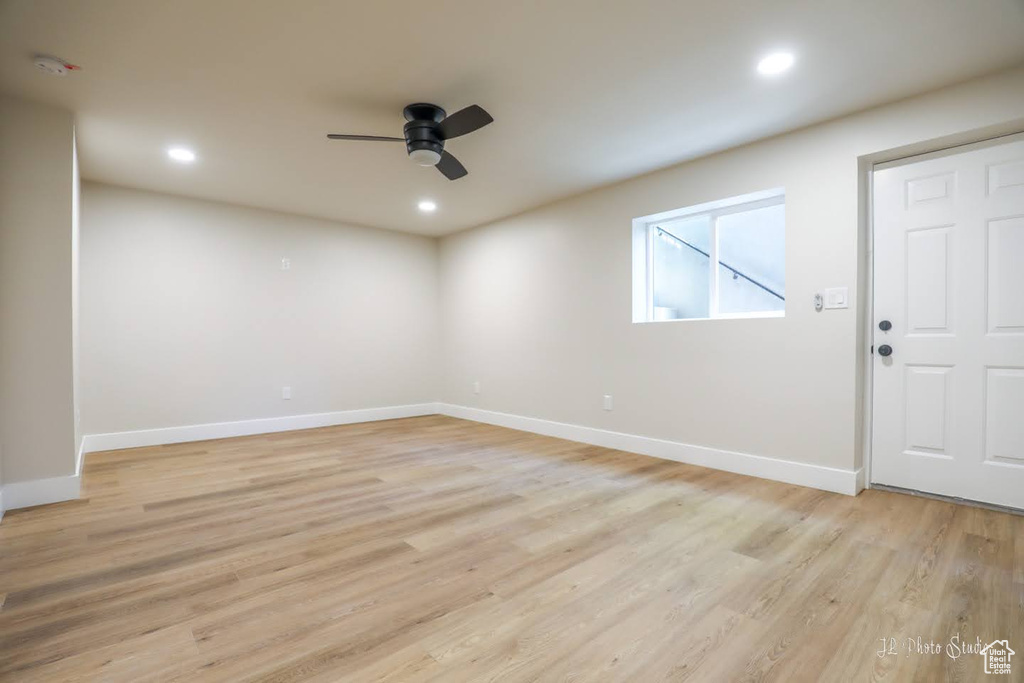 Empty room featuring light hardwood / wood-style floors and ceiling fan