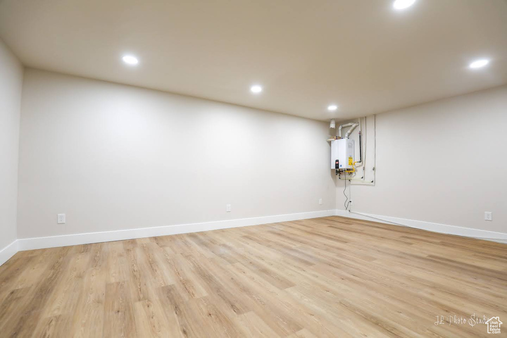 Spare room featuring light hardwood / wood-style floors and water heater