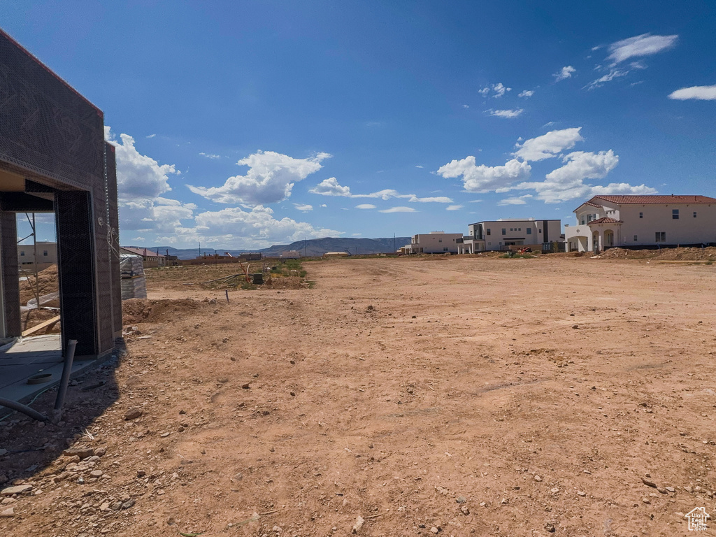 View of yard featuring a rural view and a mountain view