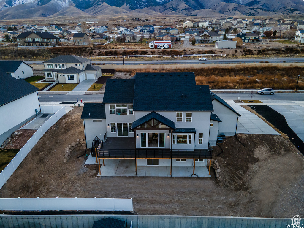 Birds eye view of property with a mountain view