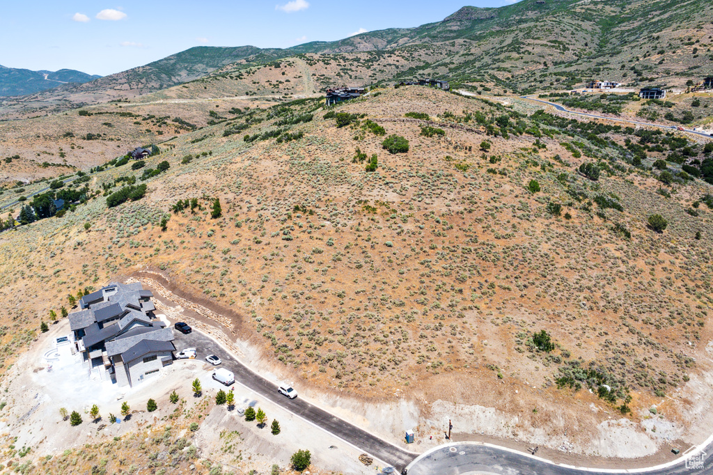 Birds eye view of property with a mountain view