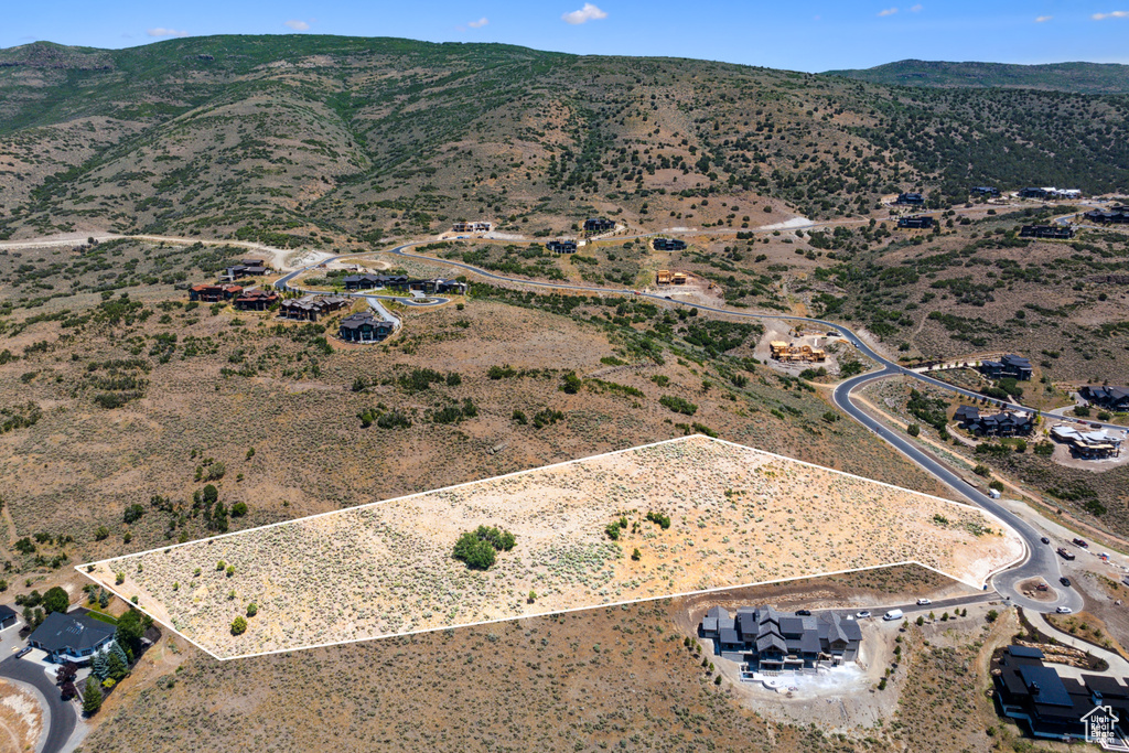 Birds eye view of property featuring a mountain view