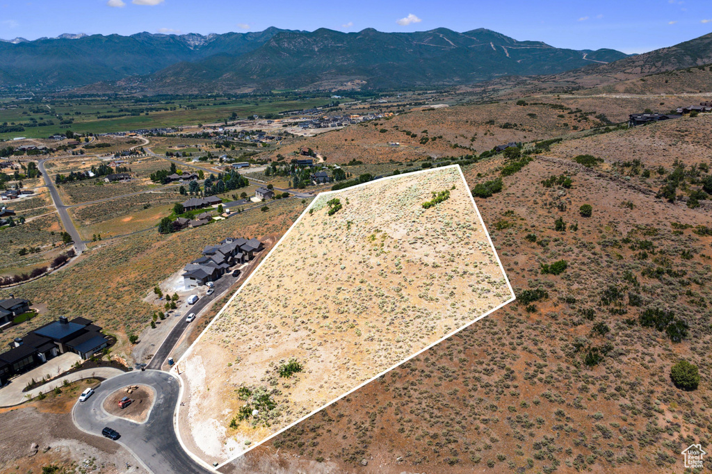 Birds eye view of property with a mountain view