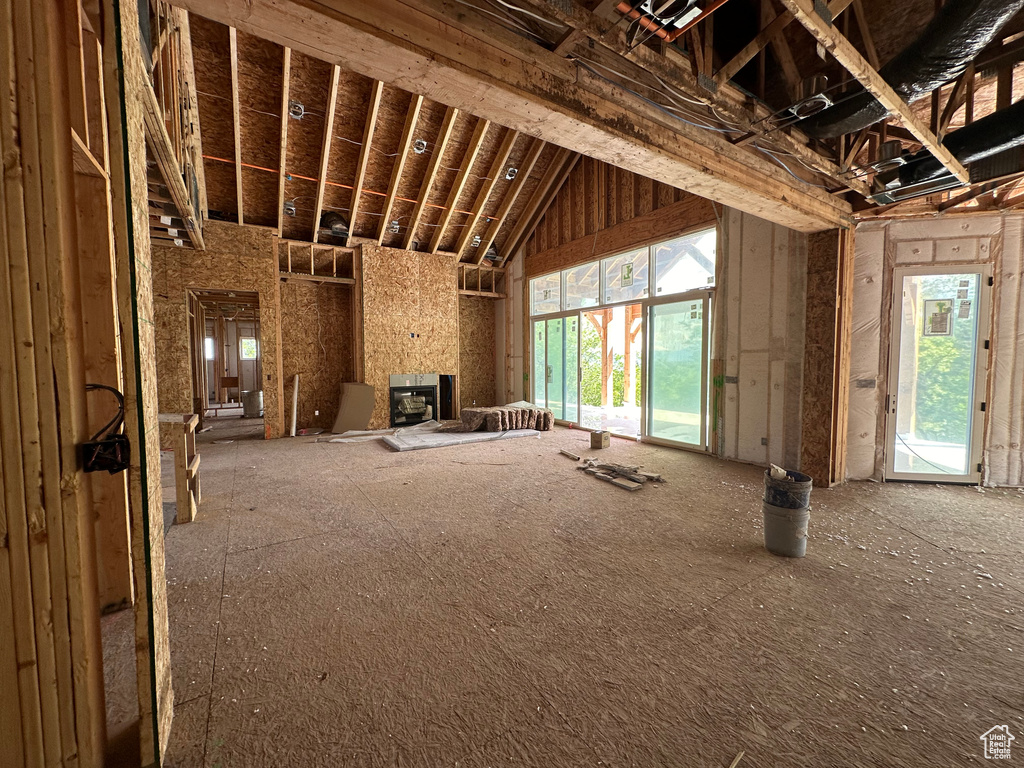 Miscellaneous room featuring a healthy amount of sunlight and a large fireplace