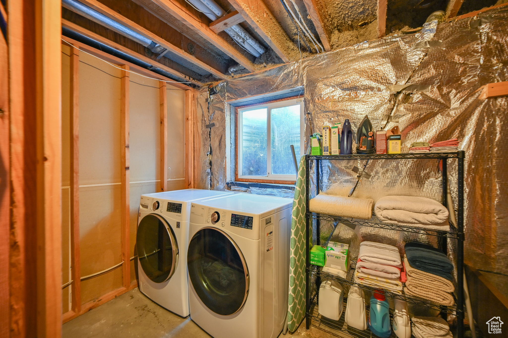 Washroom featuring washing machine and dryer