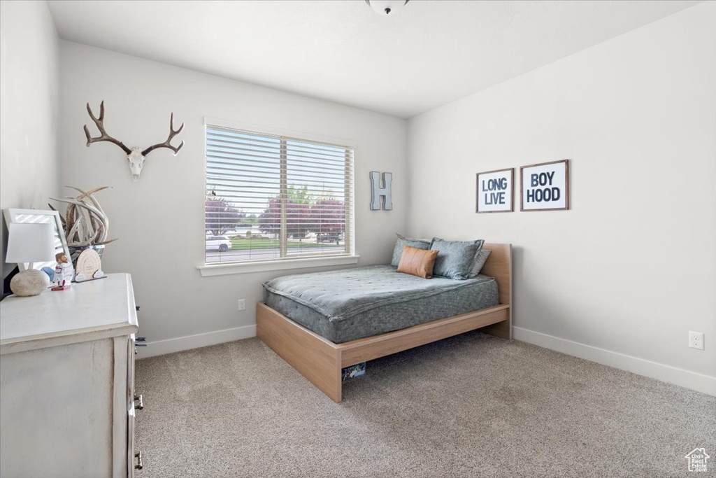 Bedroom featuring carpet flooring