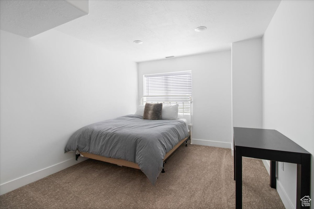 Bedroom with carpet flooring