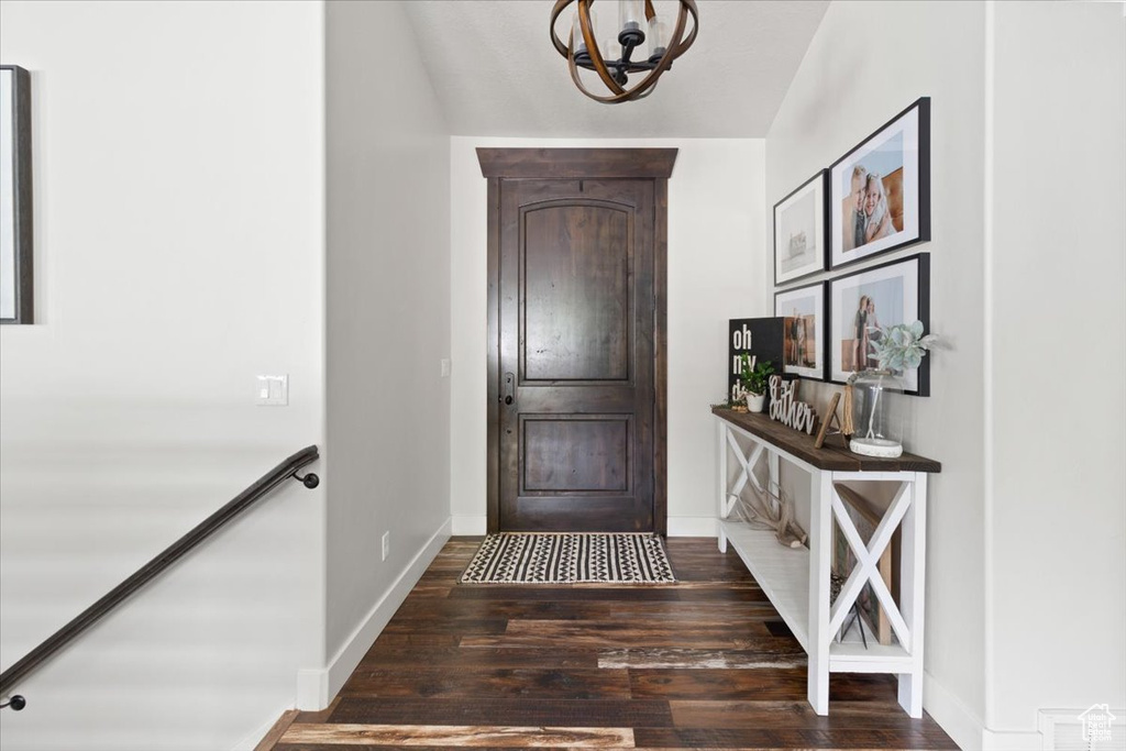 Entryway featuring a notable chandelier and hardwood / wood-style floors