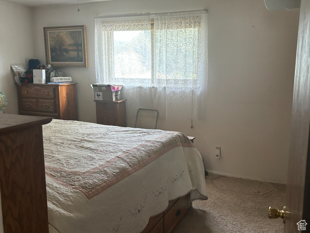 Bedroom featuring carpet and ceiling fan