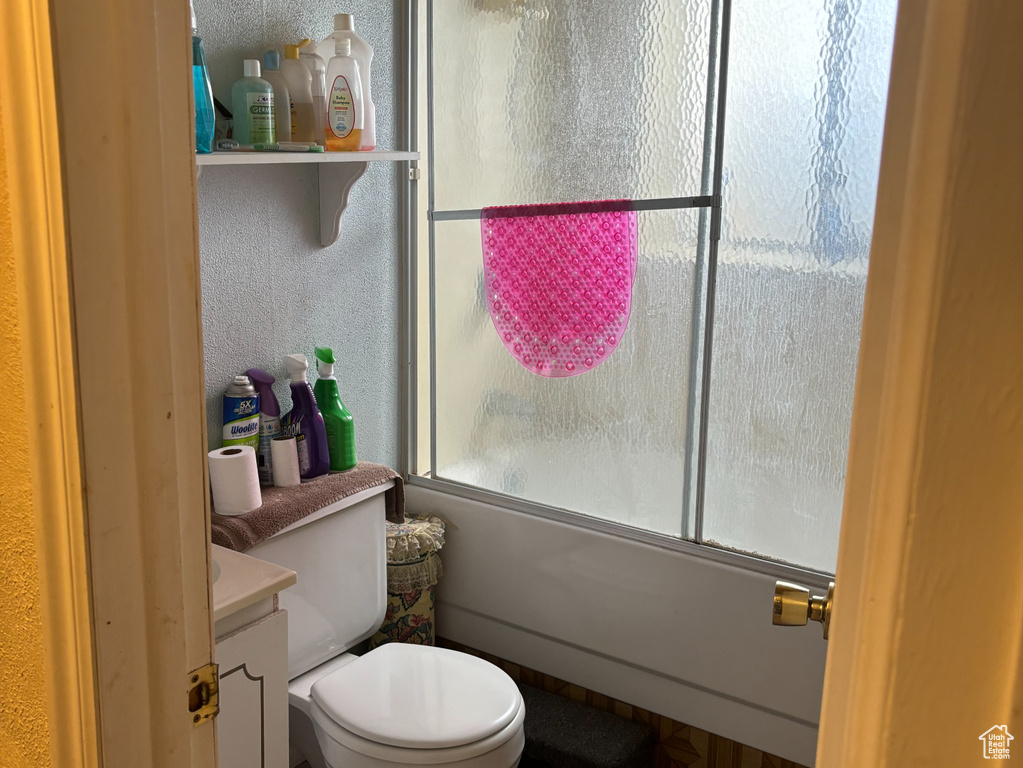 Bathroom featuring plenty of natural light, vanity, and toilet