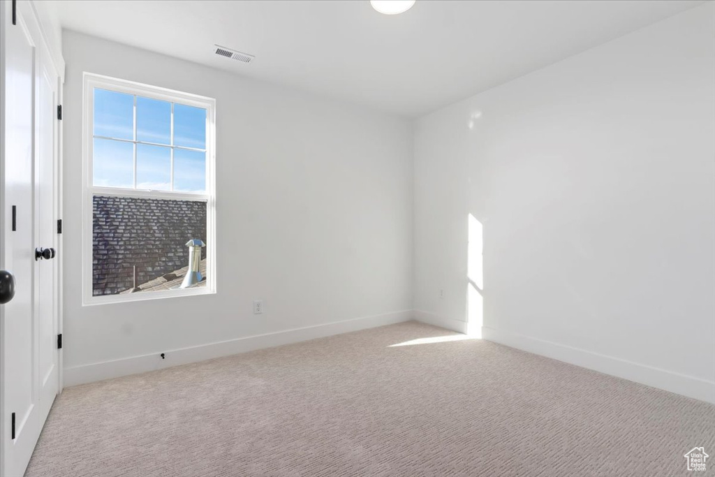 View of carpeted spare room