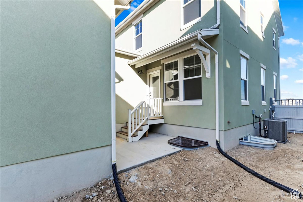 View of home\\\'s exterior featuring cooling unit