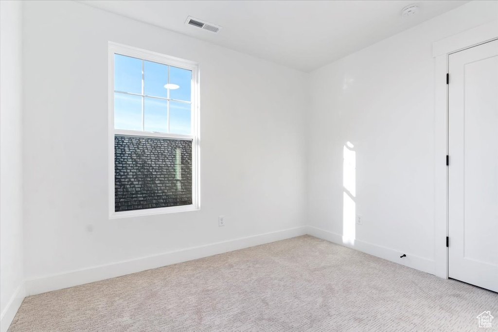 Spare room with light carpet