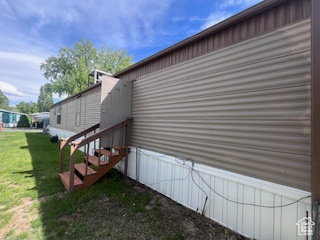 View of home's exterior with a lawn