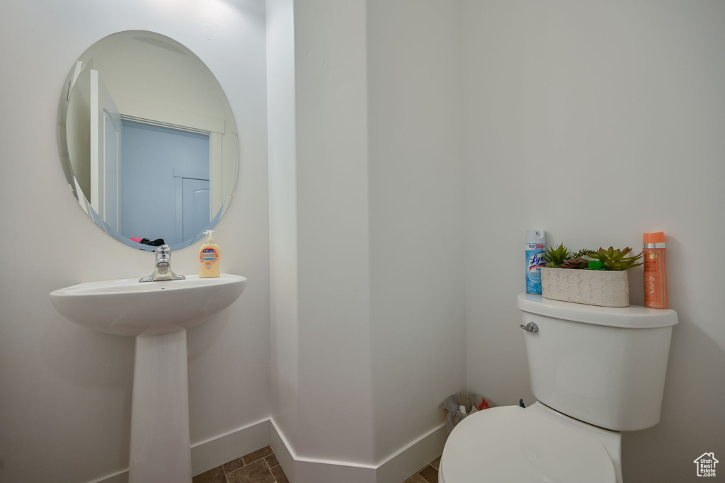 Bathroom featuring tile flooring and toilet