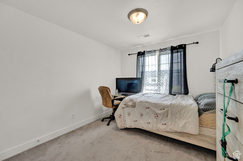 Bedroom featuring carpet flooring