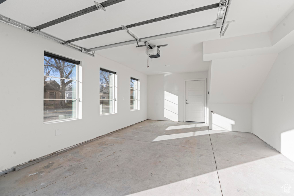 Garage featuring a garage door opener