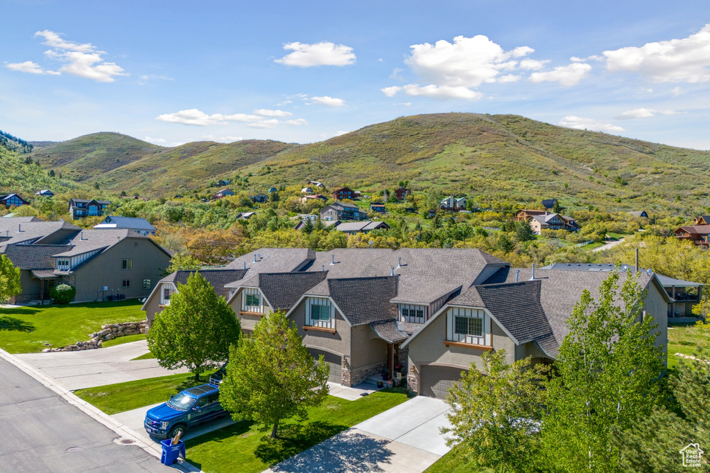 Birds eye view of property with a mountain view