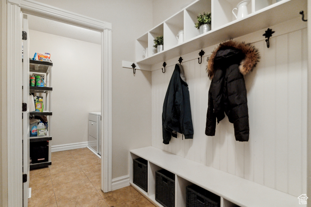 Mudroom with light tile floors