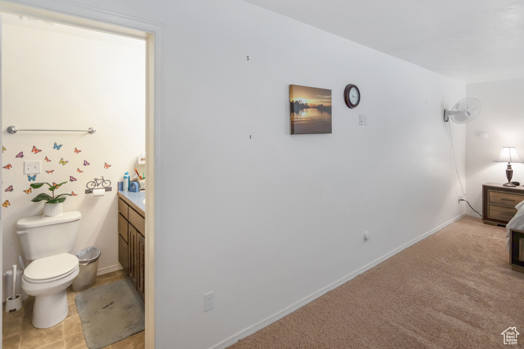 Interior space with tile floors, toilet, and vanity
