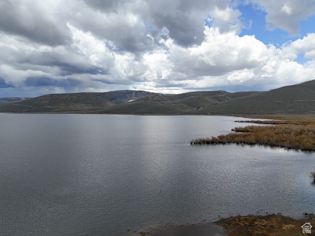 Property view of water with a mountain view