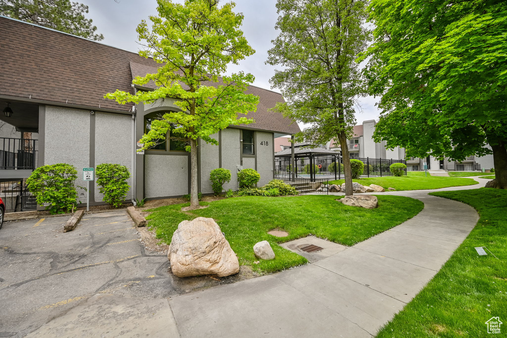 View of front of house with a gazebo and a front lawn