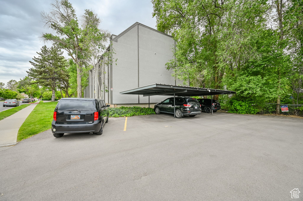 View of vehicle parking with a carport