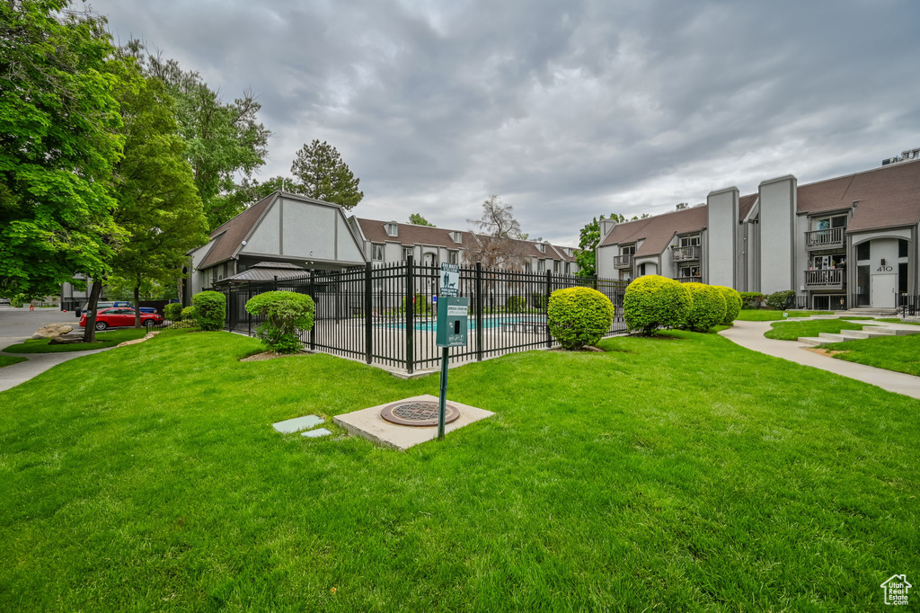 View of home's community with a gazebo and a yard