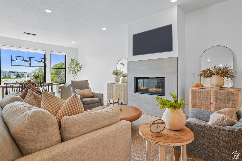 Living room featuring a tiled fireplace