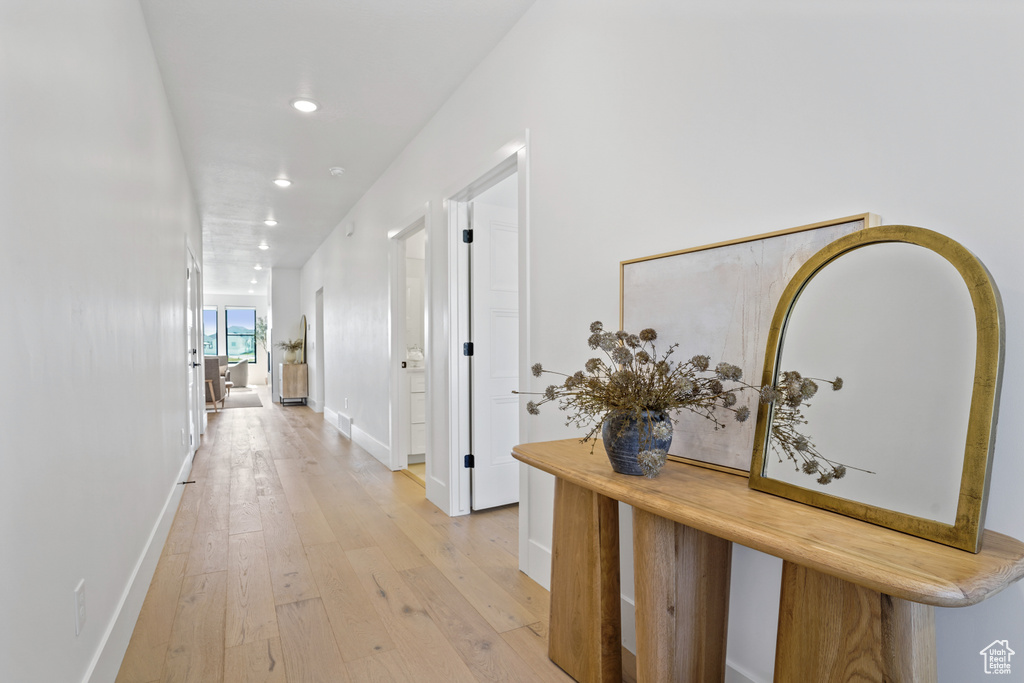 Hall featuring light wood-type flooring