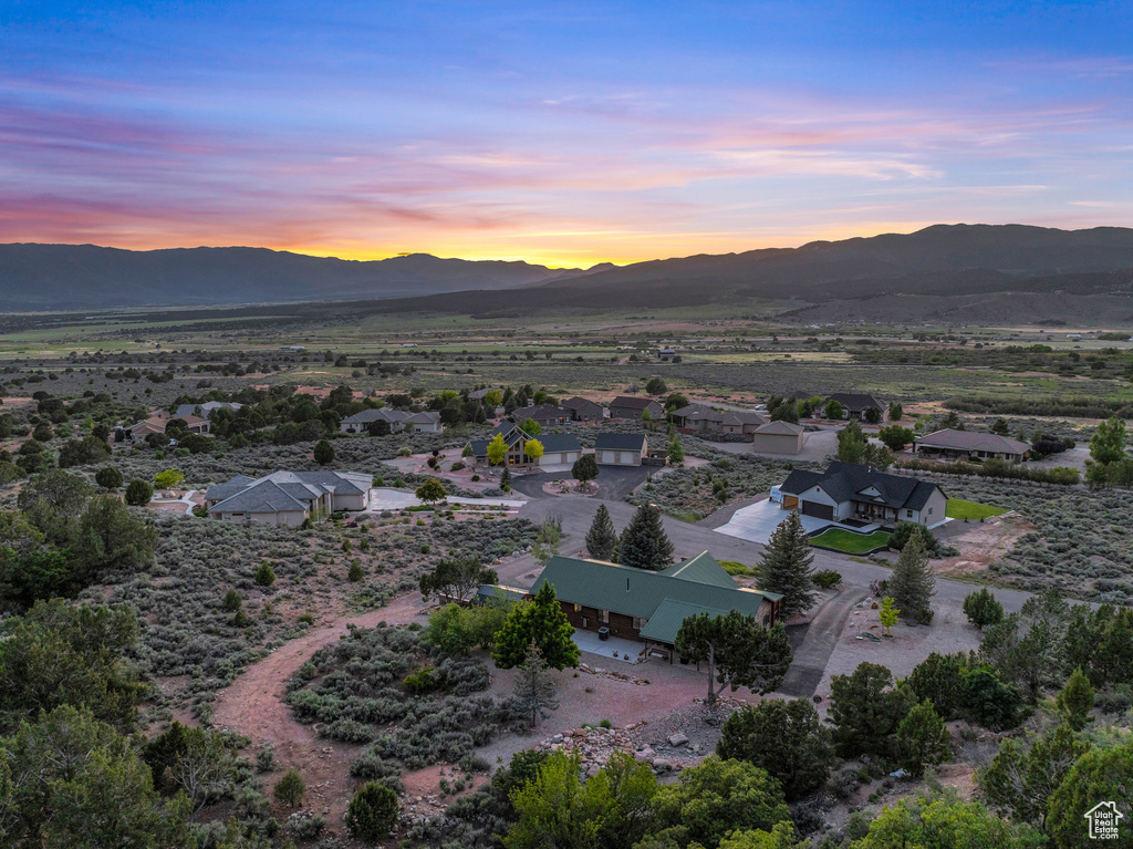 Aerial view at dusk featuring a mountain view