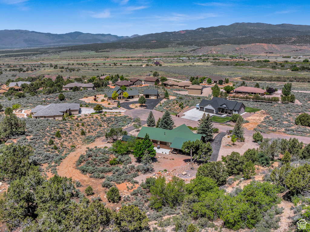 Birds eye view of property with a mountain view