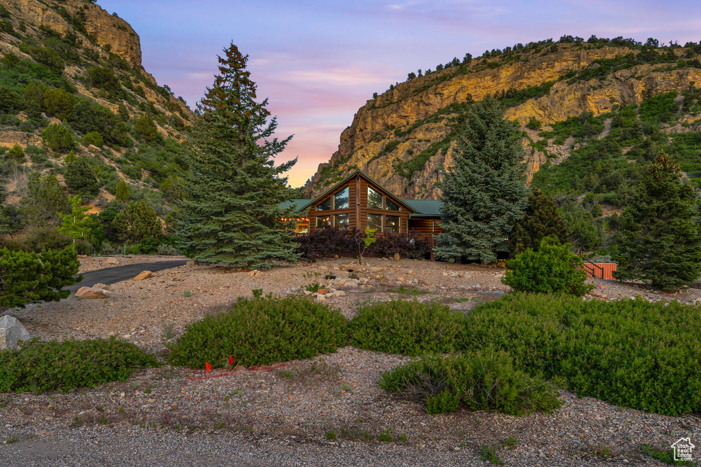 Yard at dusk with a mountain view