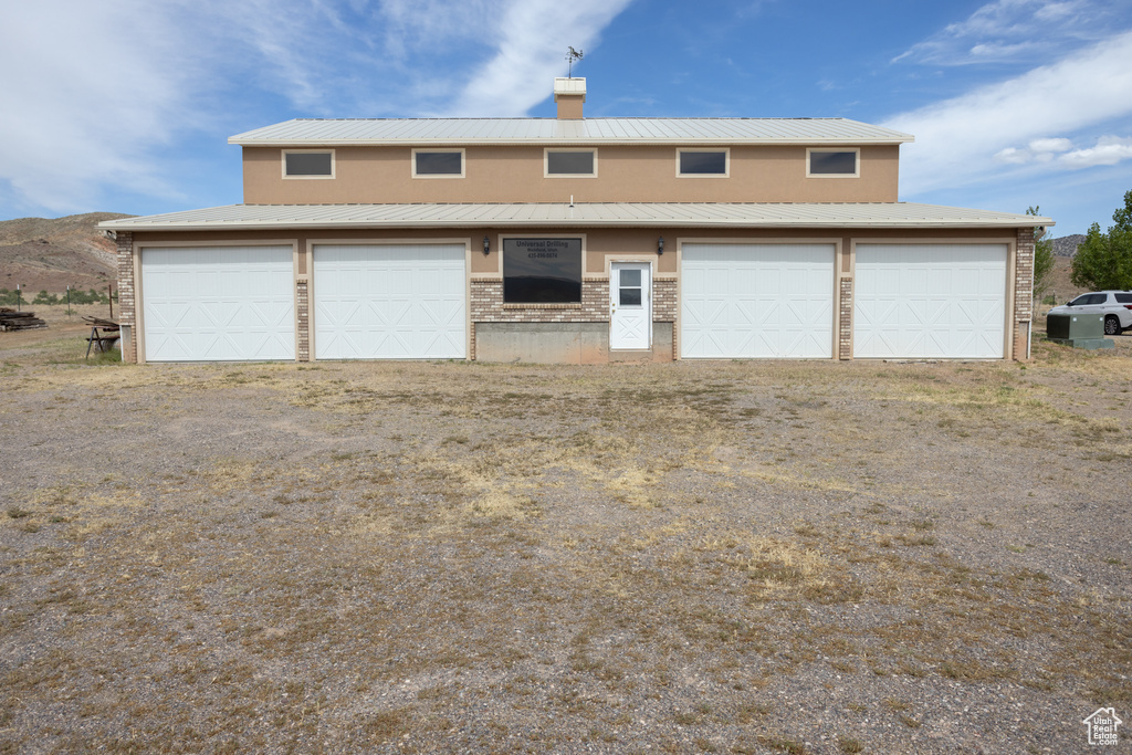 View of front of home featuring a garage