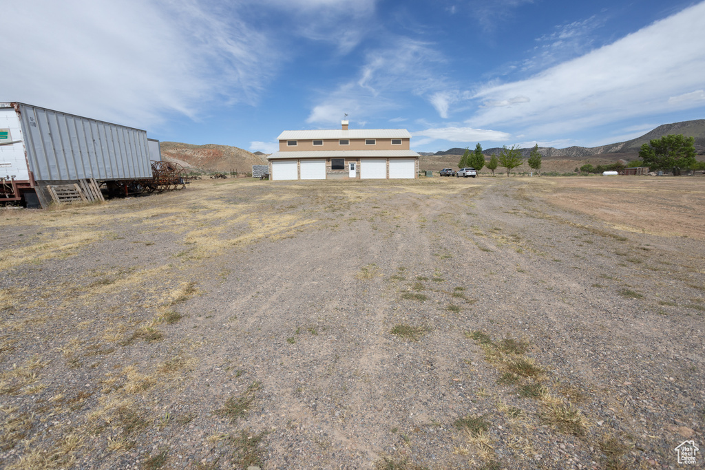 Exterior space featuring a garage and a mountain view