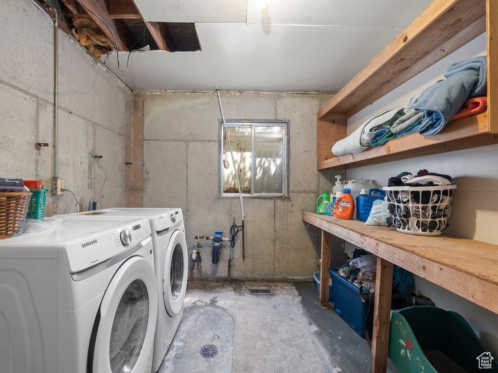 Laundry area featuring washing machine and clothes dryer