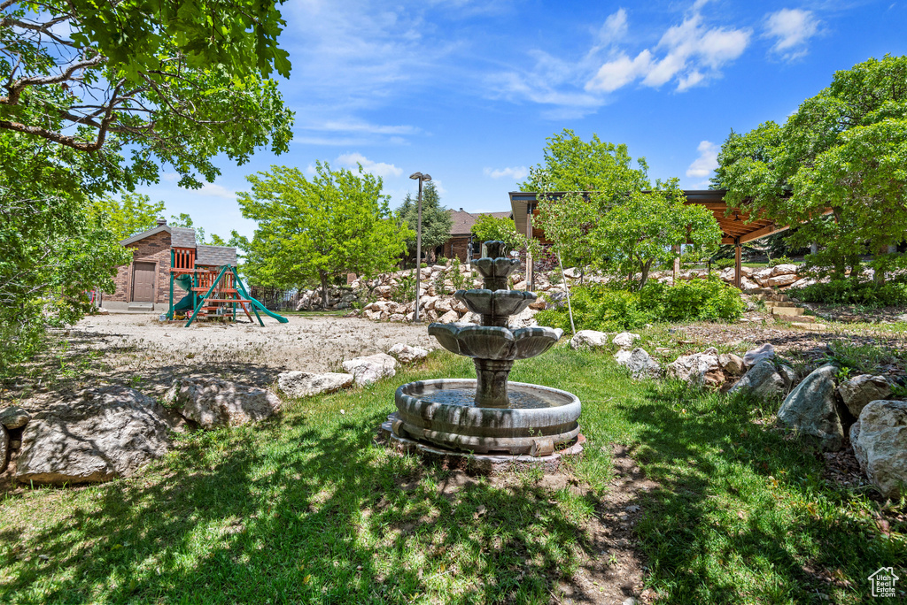 View of yard with a playground