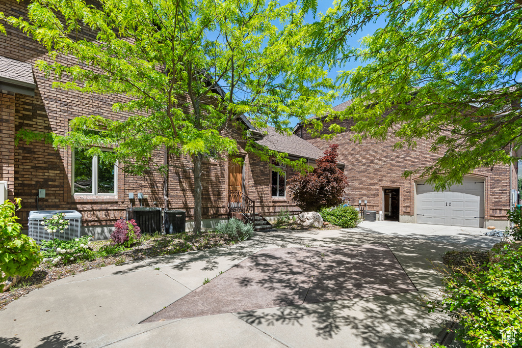 View of front of house featuring central AC