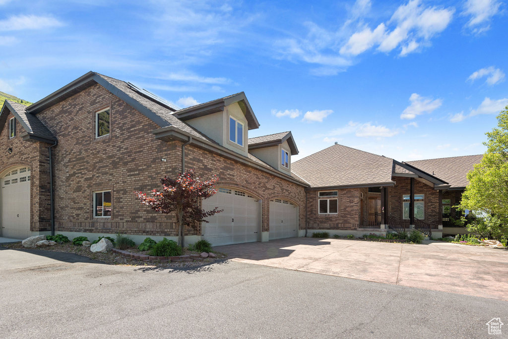 View of front of property featuring a garage