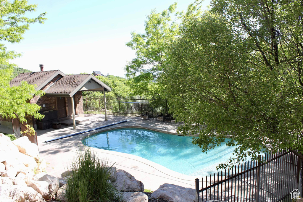 View of swimming pool featuring a patio area