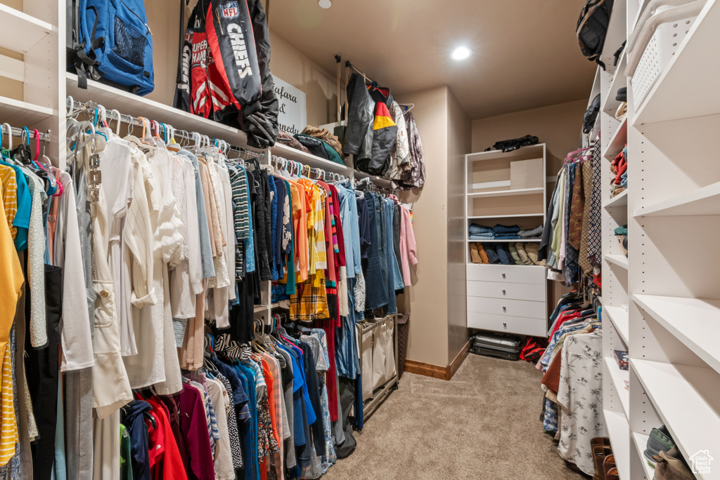 Walk in closet featuring carpet flooring