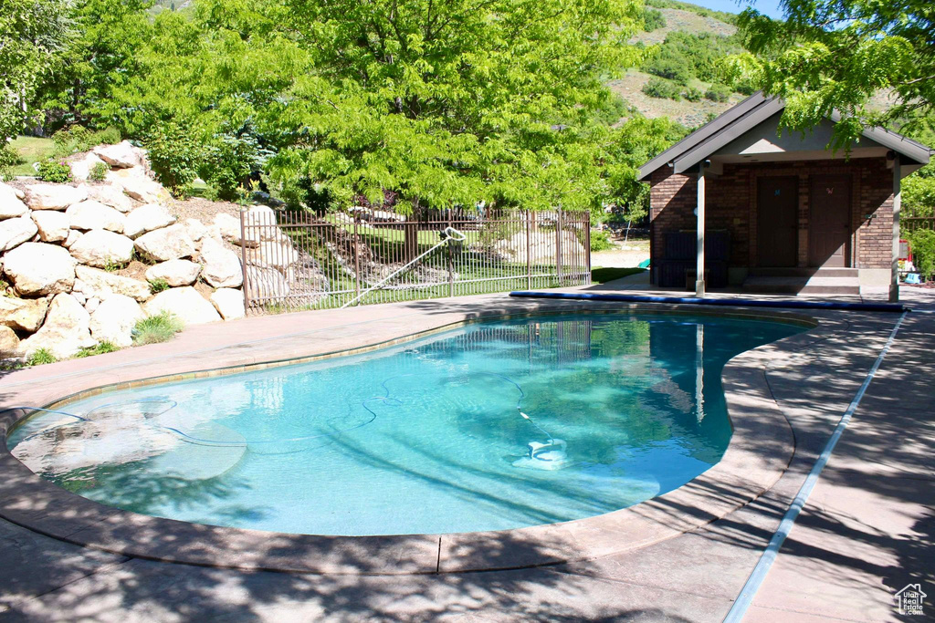 View of swimming pool featuring a patio