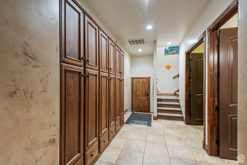 Hallway with light tile floors