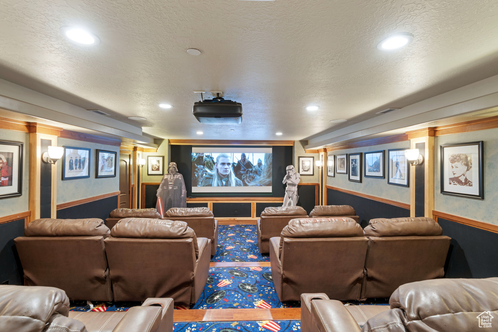 Home theater room with a textured ceiling