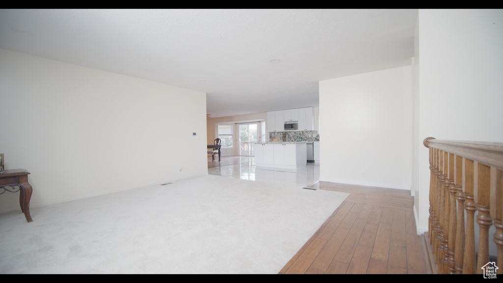 Living room with light hardwood / wood-style floors