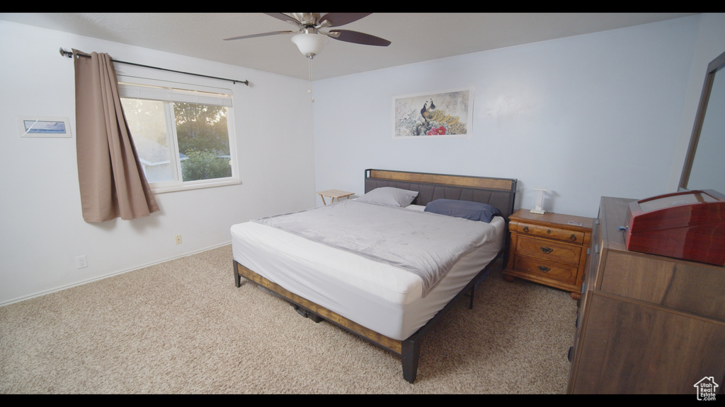 Bedroom with carpet flooring and ceiling fan