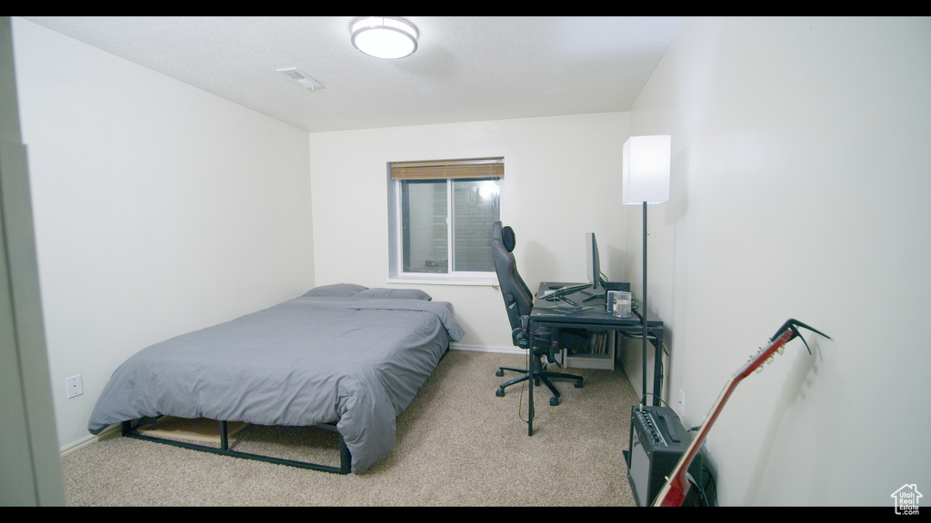 Bedroom featuring carpet